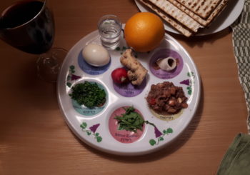 Passover seder plate with wine and matza